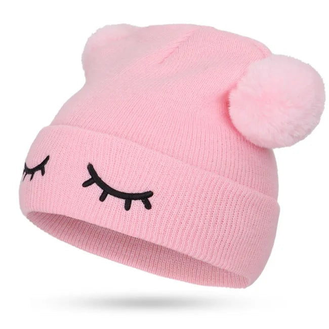 BONNET POMPON YEUX FERMÉS