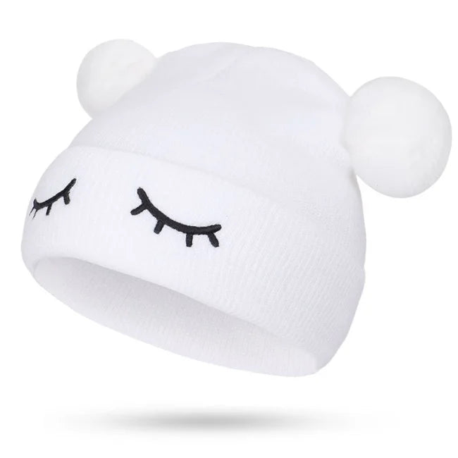 BONNET POMPON YEUX FERMÉS